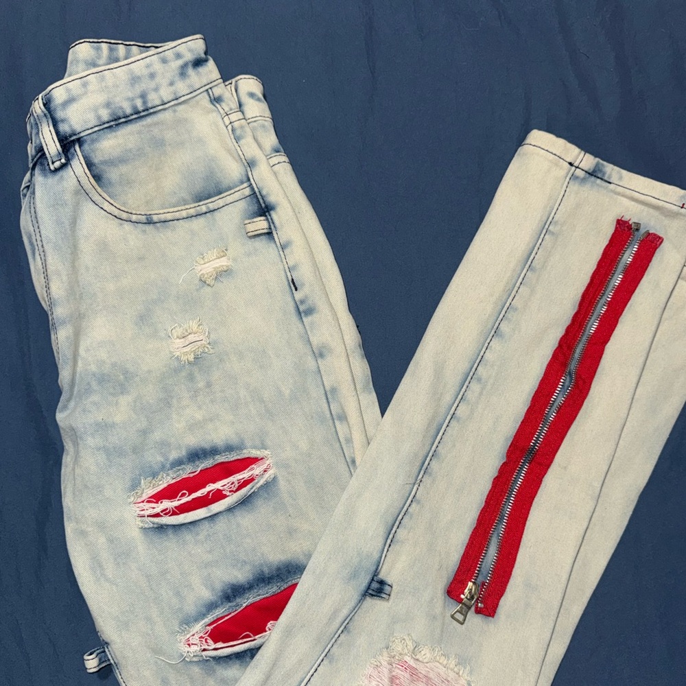 Light Blue Distressed Jeans with Red Accents